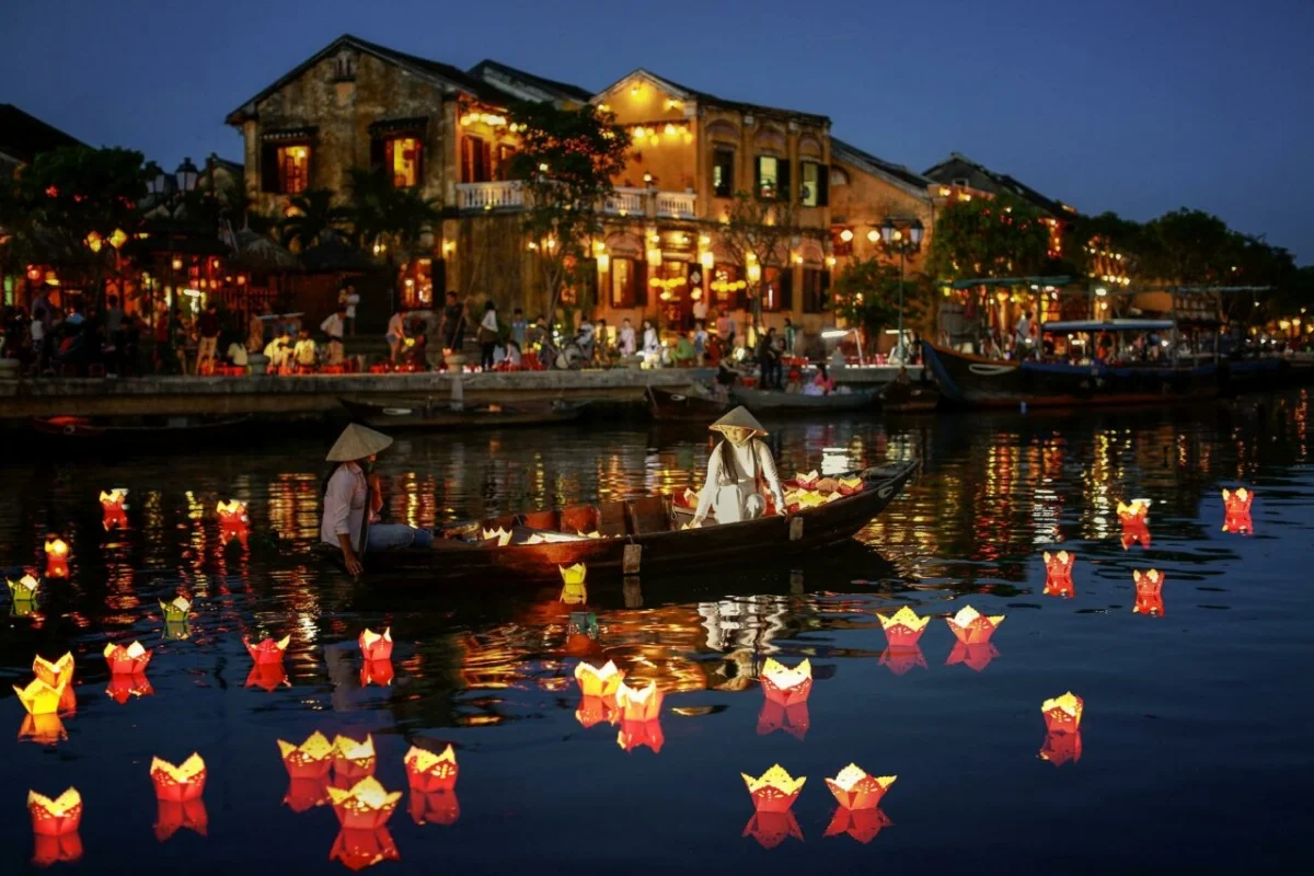 Thousands of colorful silk lanterns lighting up the old yellow streets and the Hoai River in Hoi An.