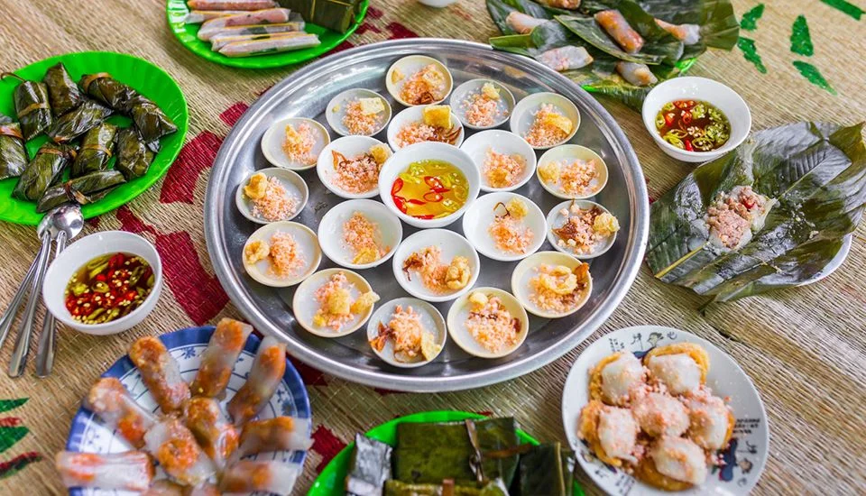 A traditional Hue platter of Banh Beo, Banh Nam, and Banh Loc served with shrimp topping and sweet fish sauce