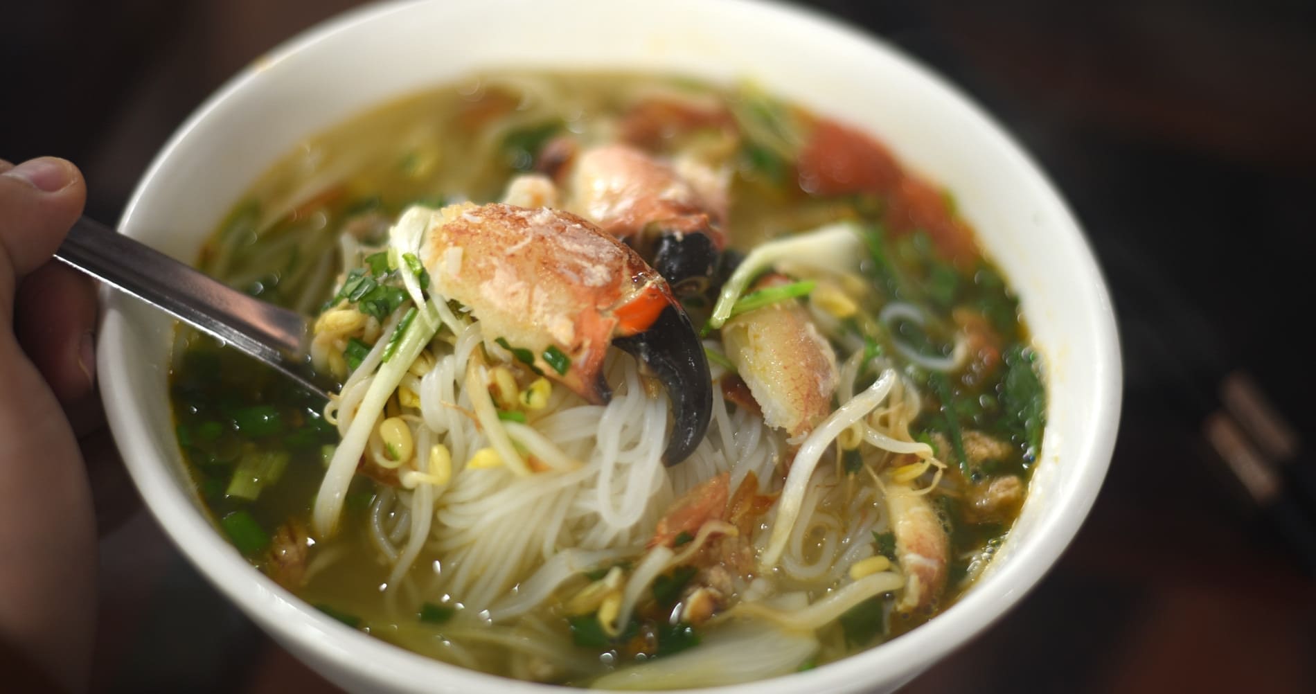A bowl of Bun Cu Ky (Fiddler Crab Noodles), a famous local breakfast dish in Ha Long City.